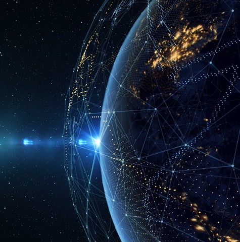 An image of the earth from space with bursts of light showing a network around it